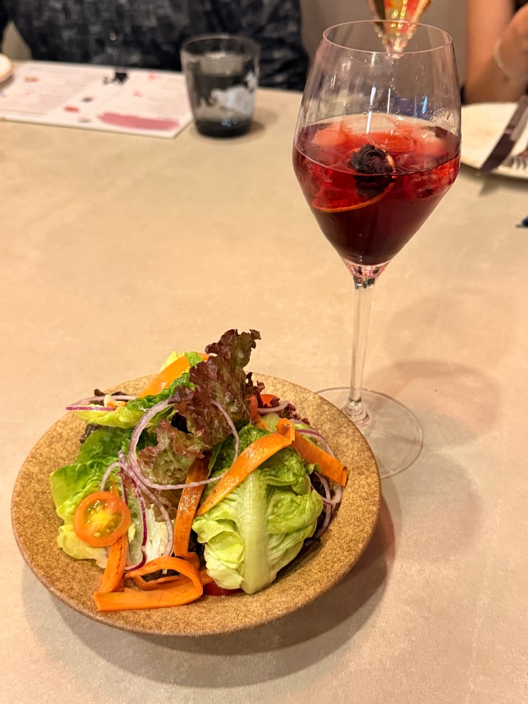 A glass of red wine at Amor