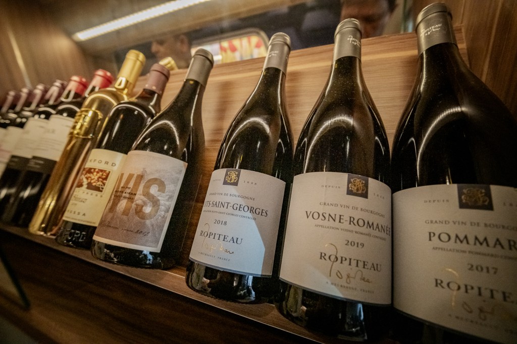 Wine bottles on display at Amor