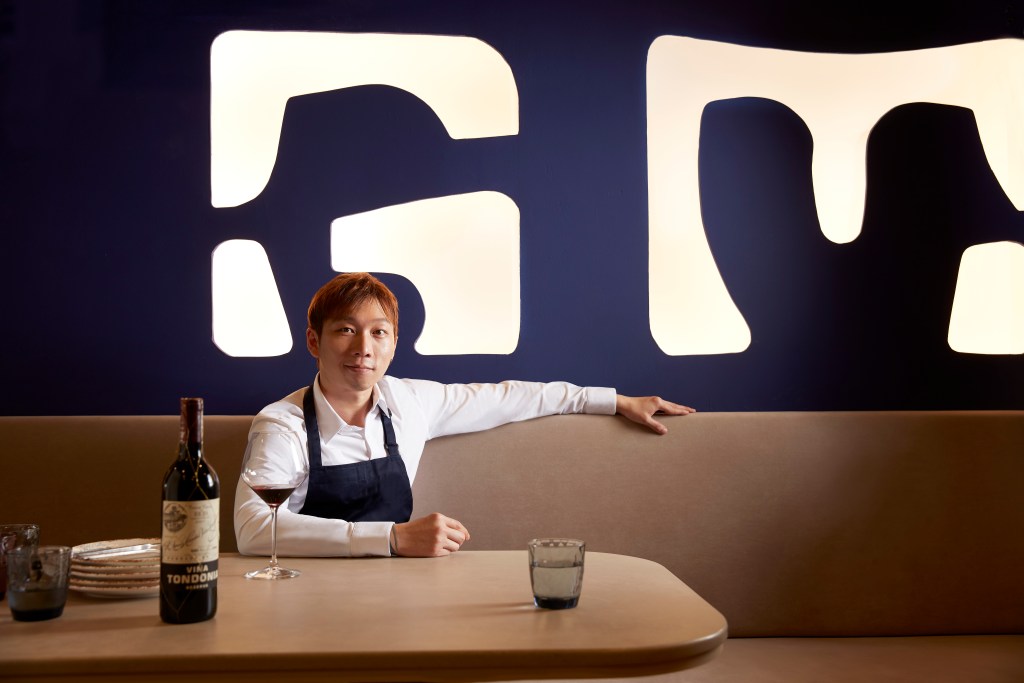 A glass of Red Wine at the table with Chef Wang