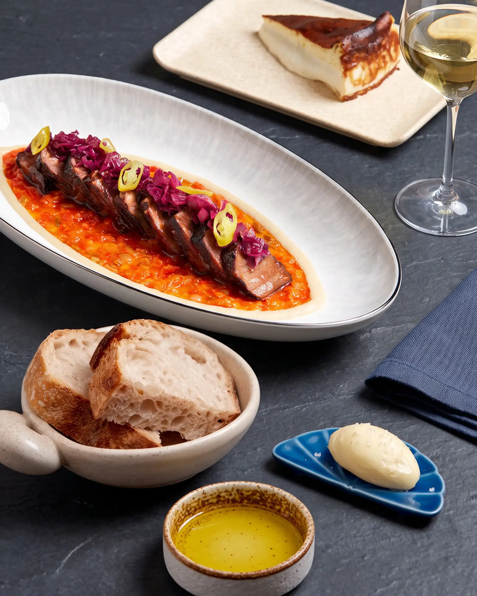 Wagyu Short Rib, sourdough and Basque cheesecake at Amor Singapore